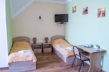 Фото номера Улучшенный четырехместный номер Гостевой дом Guest House Stara Rus г. Каменец-Подольский 4
