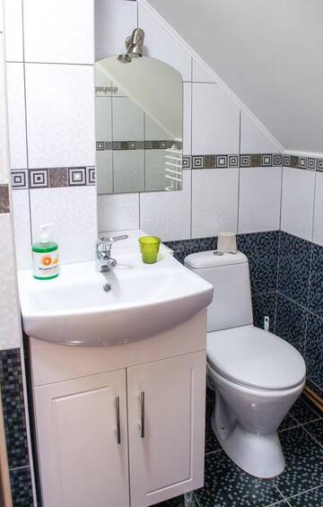 Фото номера Cемейный номер с собственной ванной комнатой Мини-отель Home Hotel г. Каменец-Подольский 3